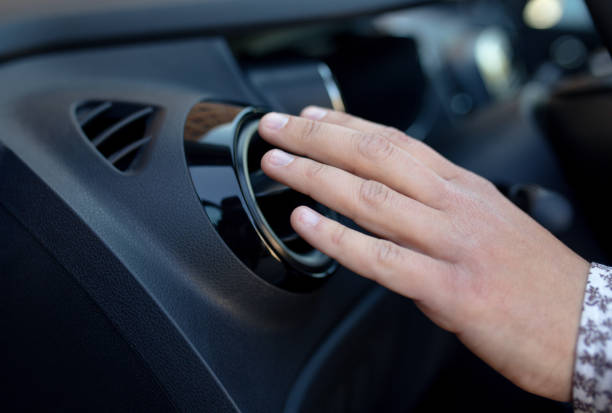 istock Driver hand on air ventilation grille with power regulator, modern car interior detail 685847548