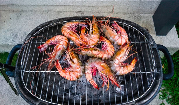 istock Large fresh royal prawns on the grill 685847570
