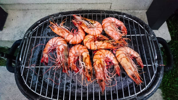 istock Large fresh royal prawns on the grill 685847622