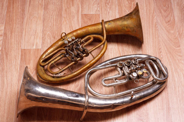istock two old rusty alto saxhorn on wooden background 685849332