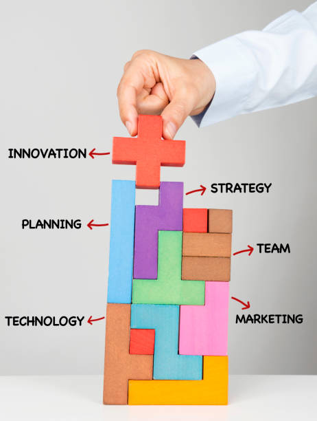 istock Business woman putting puzzle piece 685851856