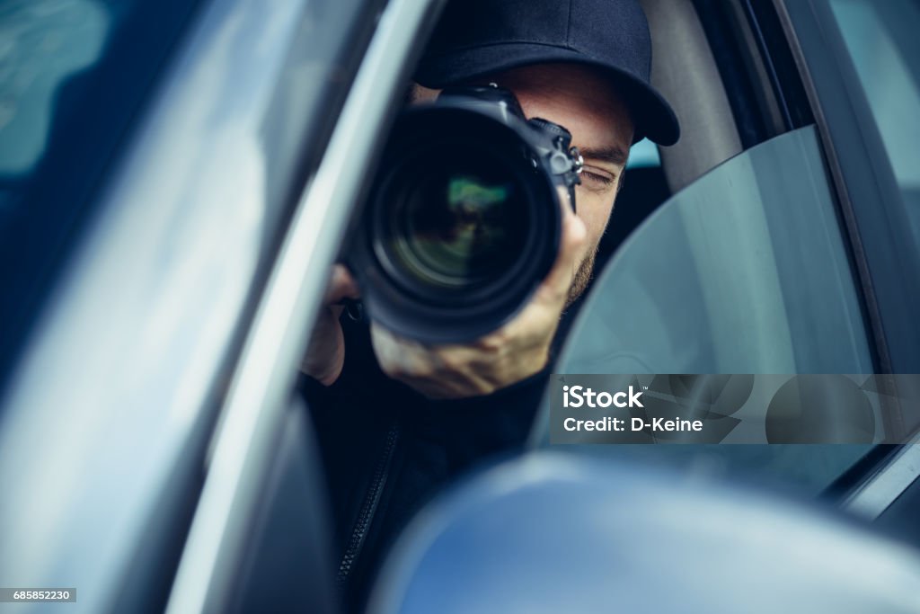 Spy Spy at work. Man with photo camera. Detective Stock Photo