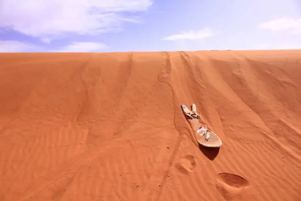 Sand board on the desert in sahara