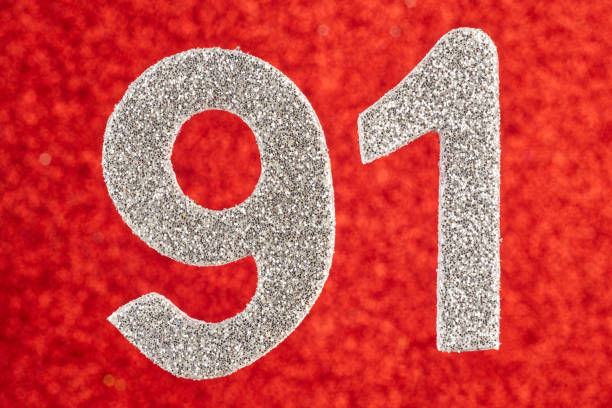 istock Number ninety-one silver color over a red background. Anniversary. 685854750