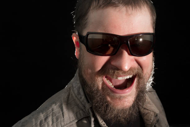 istock Handsome bearded man in sunglasses emotional portrait 685855144