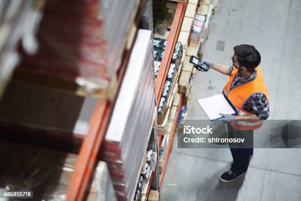 Checking Barcodes Stock Photo - Download Image Now - Warehouse, Freight Transportation, Distribution Warehouse
