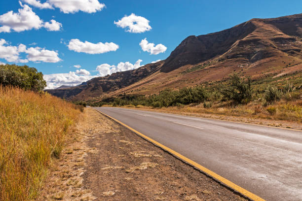 istock Asphalt Road Running Through Dry Orange Winter Mountain Landscape 685858844
