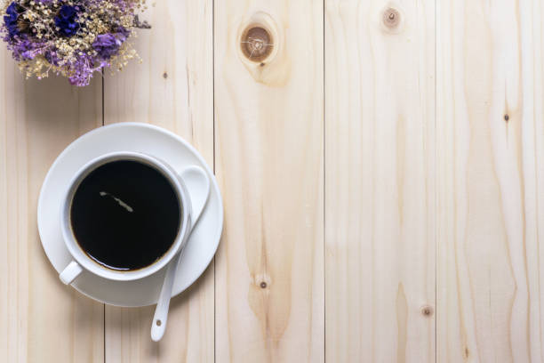 istock coffee and flowers on wooden background, flat lay 685859058