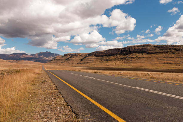 istock Asphalt Road Running Through Dry Orange Winter Mountain Landscape 685859136