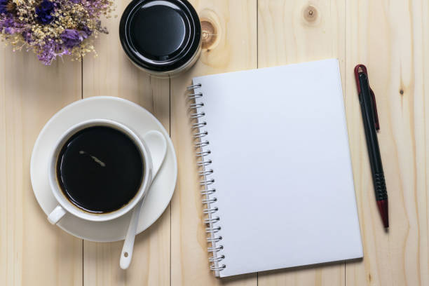 istock Flat lay desk with coffee, notebook and flowers 685859150