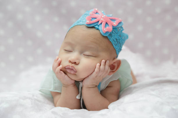 istock Newborn baby girl sleeping. 685860396