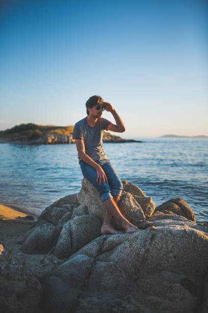 istock Hipster man enjoying the day on the beach 685860506