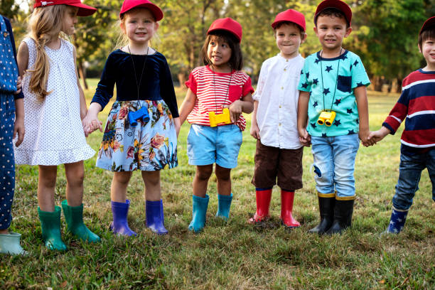 istock Group of kids school field trips learning outdoors botanic park 685863322