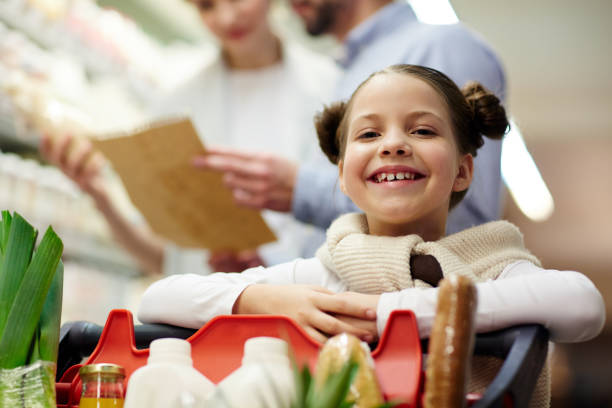 istock Smiling Girl Shopping with Parents 685863354