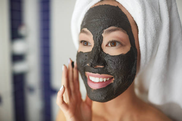 istock Smiling Woman Using Beauty Treatment in Shower 685863562