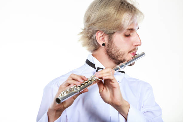 istock Male flutist playing his flute 685864200