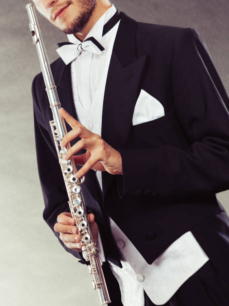 istock Elegantly dressed musician holding flute 685864418