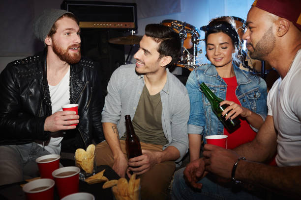 istock Trendy Young People Drinking Beer in Club 685865474