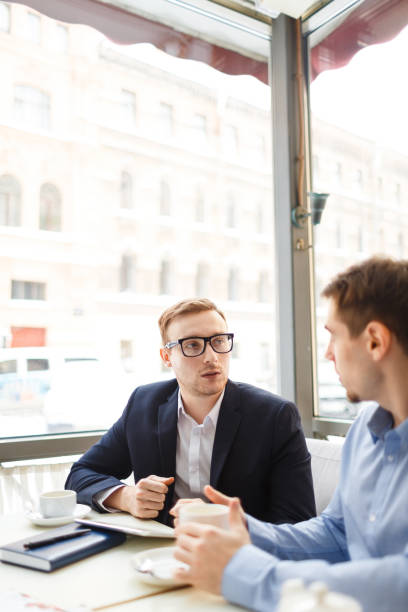 istock Businessman Meeting with Partner in Open Air Cafe 685865716