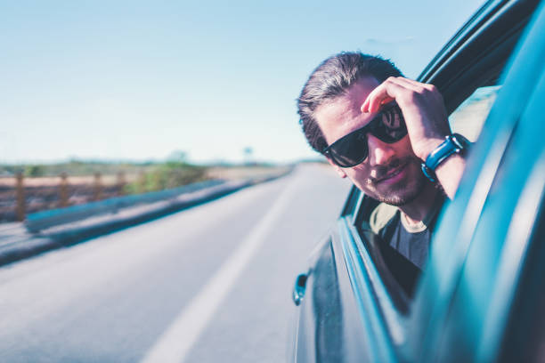 istock Beautiful man on the car window 685866542