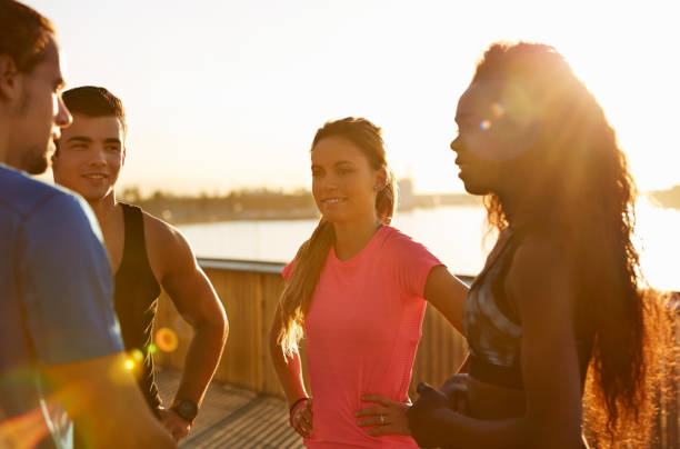 istock Athletes discussing at promenade at sunset 685868350