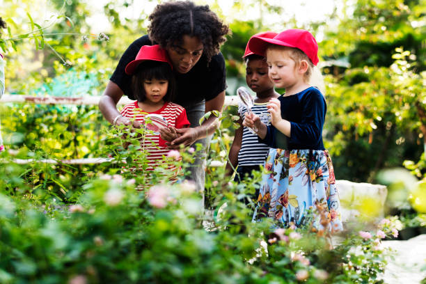 istock Teacher and kids school learning ecology gardening 685869298
