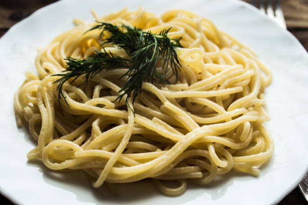 plate with spagetti and dill