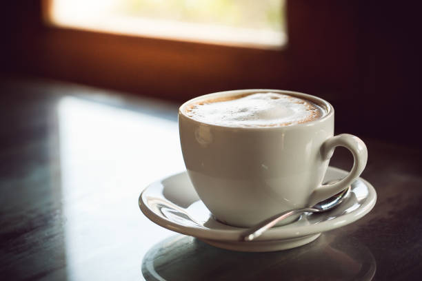 istock cup of coffee on wooden table 685870496