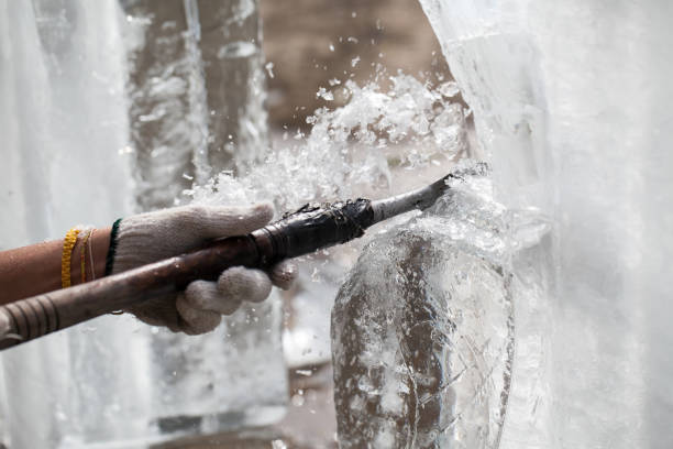 istock man is carving the ice sculpture for wedding 685871344