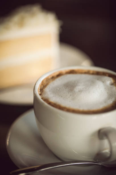 istock cup of coffee and cake on wooden table 685871368