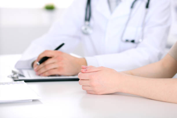 istock Doctor and patient are discussing something, just hands at the table 685872340