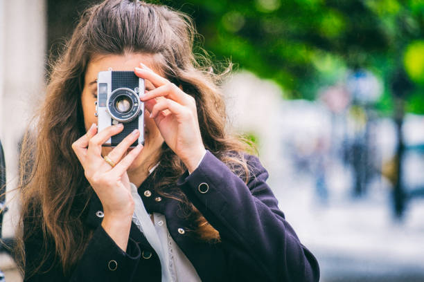 istock Young Woman With A Vintage Camera 685878600