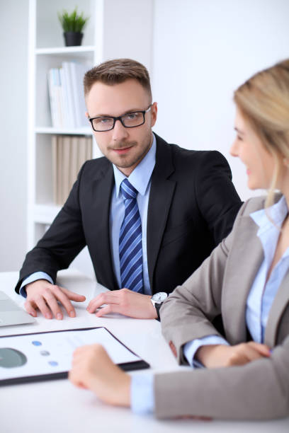 istock Two successful business partners working at meeting in office 685878724