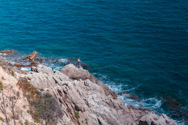 istock The Summer Blue sea with the rock 685879378