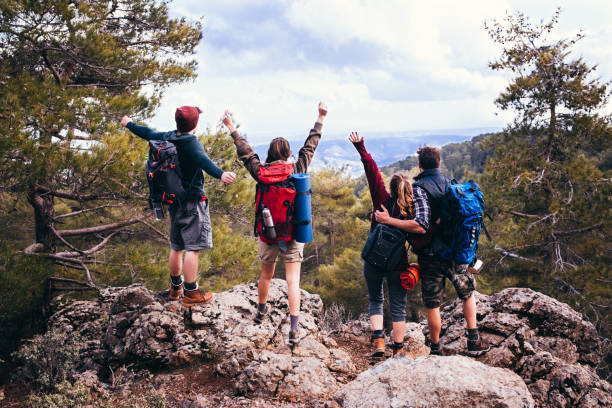 istock Excited successful hikers standing on the mountain peak 685881670