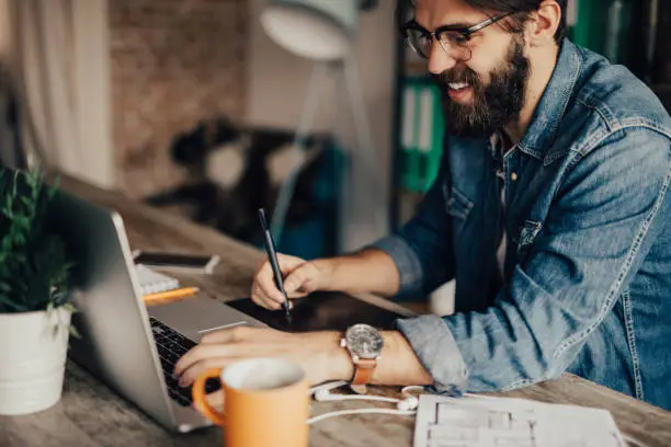 Freelancer working at his home office