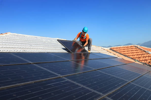 installing alternative energy photovoltaic solar panels stock photo