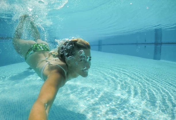 istock Women swimming in the pool 685890136