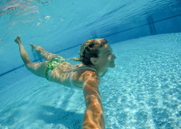 istock Women swimming in the pool 685890390