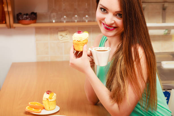 istock Woman drinking coffee and eating delicious cake. 685891518
