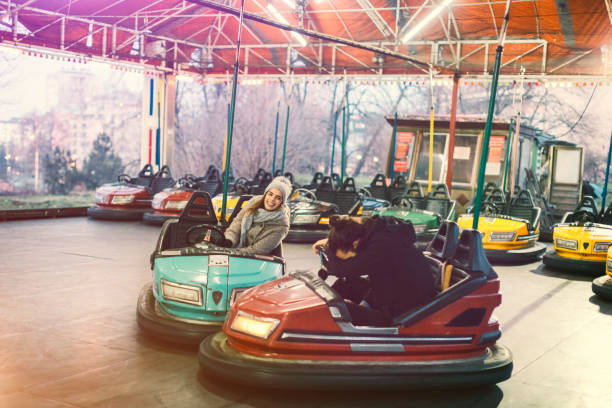 istock Couple Having Fun Riding Bumper Cars 685893194