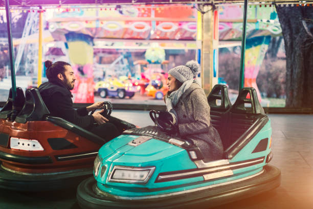istock Couple Having Fun Riding Bumper Cars 685893222
