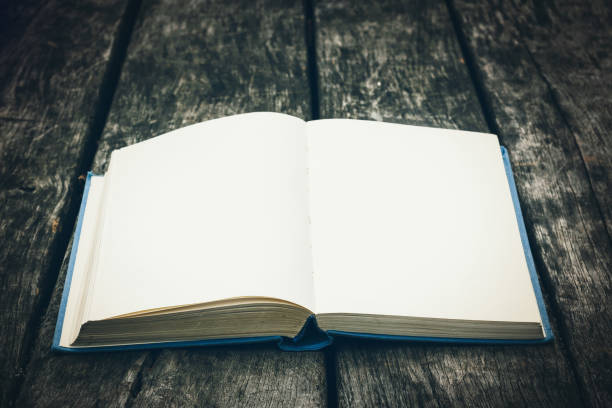 istock Old open book on a wooden table. Vintage composition. Ancient library. Antique literature. 685896454