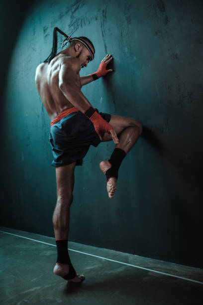 istock Muay Thai athlete training at Thai boxing indoors, ultimate fight concept 685897714