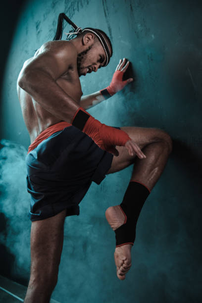 istock Muay Thai athlete training at Thai boxing indoors, ultimate fight concept 685901638