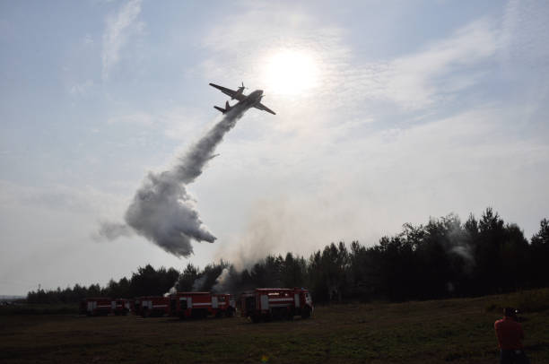 A single seater air tanker dropping fire suppressant on a wildfire.