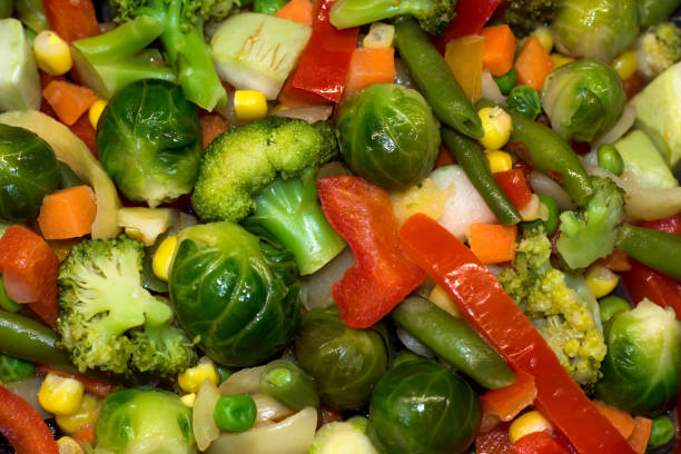 istock Fresh vegetables are stewed for dietary nutrition. Broccoli cabbage, Brussels, zucchini, corn, peas, onion, green beans, carrots, Bulgarian pepper 685908038