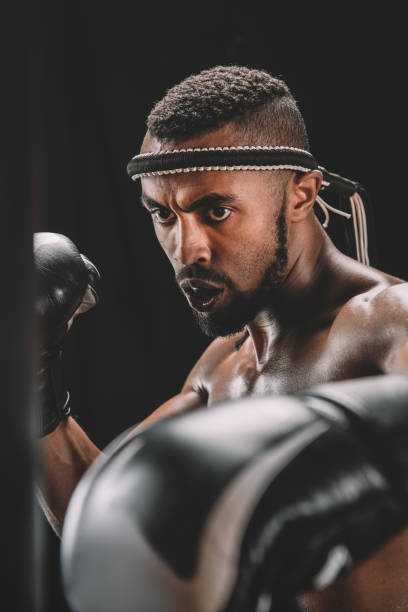 istock portrait of focused muay thai fighter training isolated on black 685914466