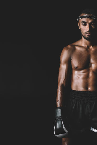 istock serious muay thai fighter with mongkhon on head isolated on black 685915574