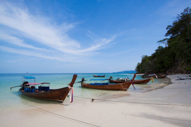 istock longtail boat with white sand beach , blue sky and rock islands , rock islands Phi Phi National Park , Krabi province,Thailand 685916010